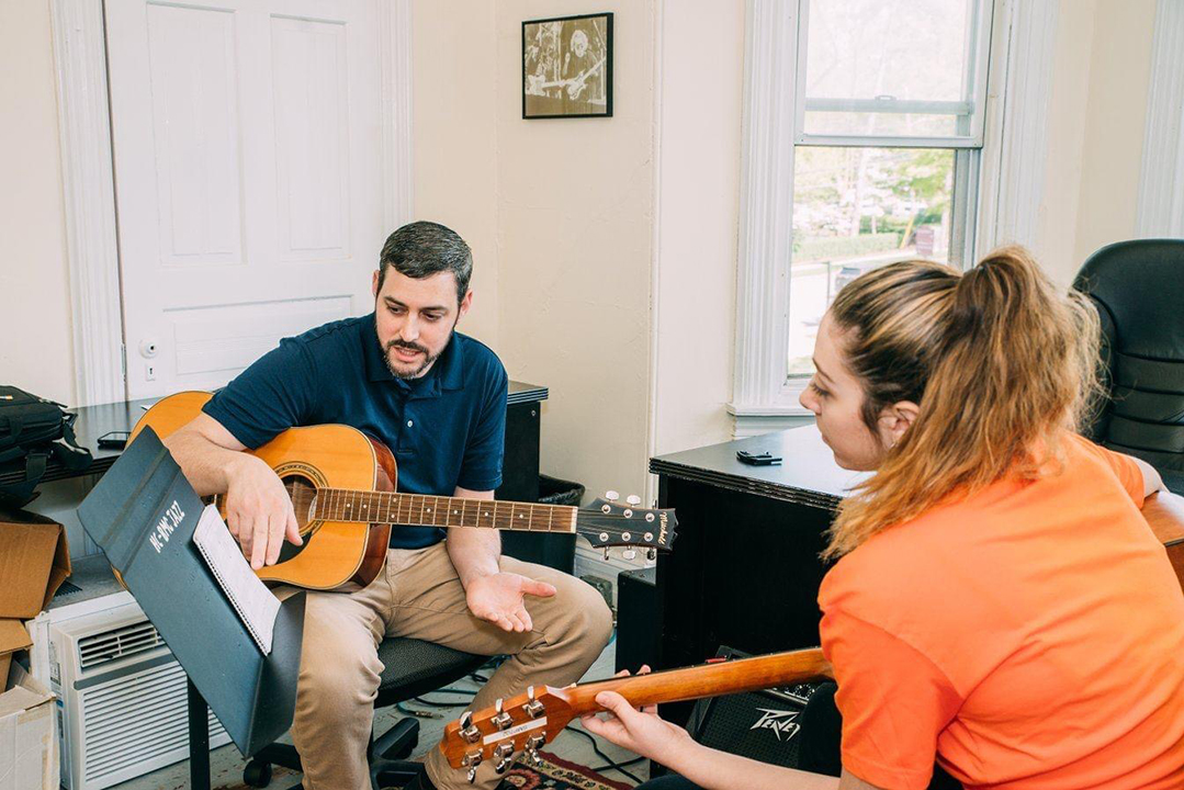 acoustic guitar lesson with teacher and student in bryn mawr